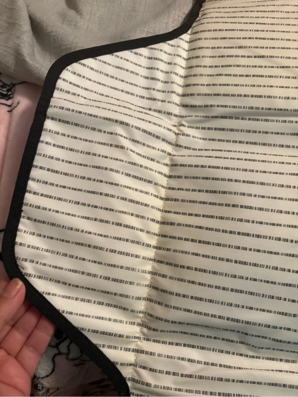 Skidaddle by Skip Hop Black & White Travel diaper bag with fold out changing pad